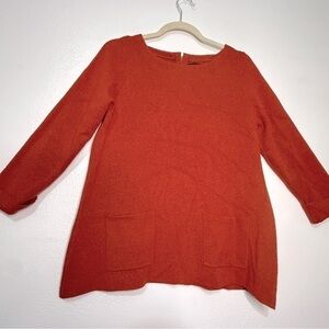 Cynthia Rowley orange sweater, 2 front lower pockets, zipper at back. Sz M.